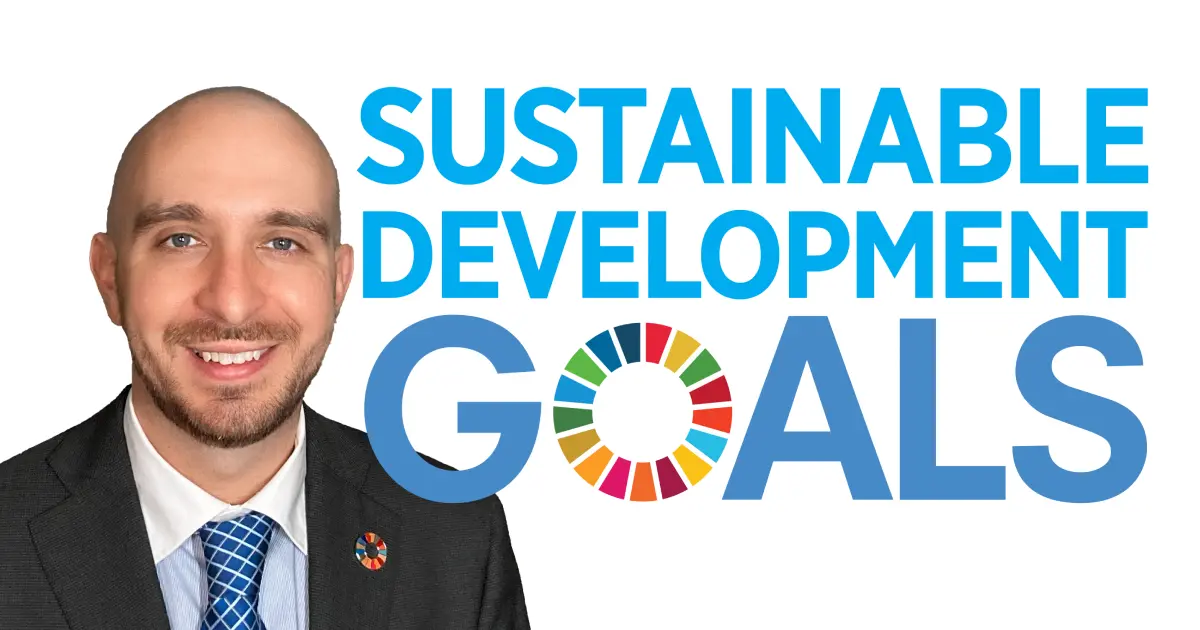 Japanese corporate style of wearing a Sustainable Development Goal lapel pin